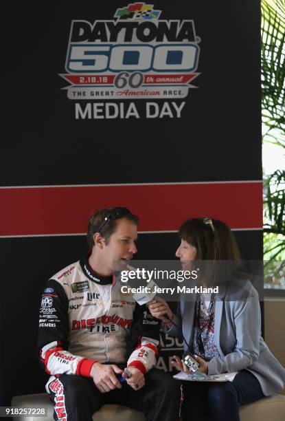 Brad Keselowski, driver of the Discount Tire Ford, speaks with the media during the Daytona 500 Media Day at Daytona International Speedway on...