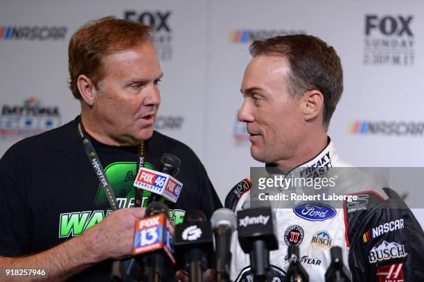 Former NASCAR driver Rusty Wallace speaks with Kevin Harvick, driver of the Jimmy John's Ford, during the Daytona 500 Media Day at Daytona...