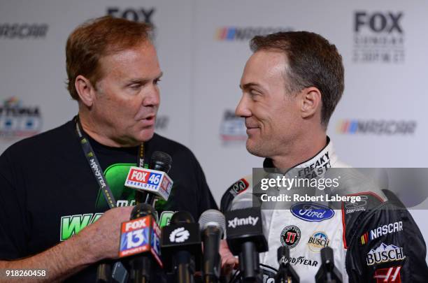 Former NASCAR driver Rusty Wallace speaks with Kevin Harvick, driver of the Jimmy John's Ford, during the Daytona 500 Media Day at Daytona...