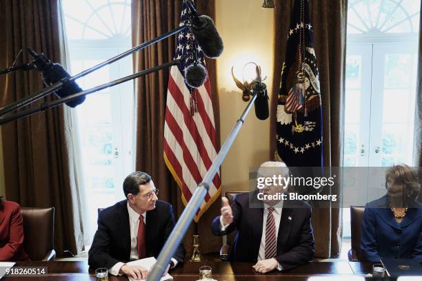 President Donald Trump, center, speaks during a meeting with bipartisan members of congress in the Cabinet Room of the White House in Washington,...