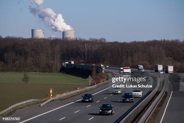 Cars driving along the A2 highway pass near the RWE Kraftwerk Westfalen coal-fired power plant on February 14, 2018 near Hamm, Germany. The plant...