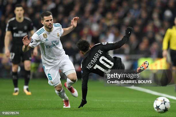Real Madrid's Spanish defender Nacho Fernandez vies with Paris Saint-Germain's Brazilian forward Neymar during the UEFA Champions League round of...