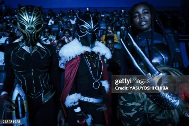 Cosplayers pose before watching the film "Black Panther" featuring Oscar winning Kenyan actress Lupita Nyong'o during Movie Jabber's Black Panther...