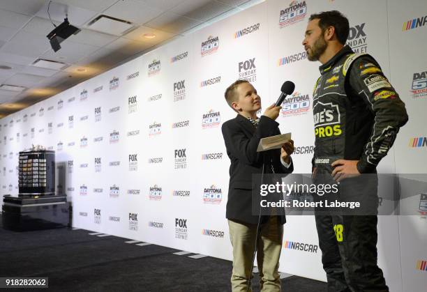 Jimmie Johnson, driver of the Lowe's for Pros Chevrolet, talks to the media during the Daytona 500 Media Day at Daytona International Speedway on...