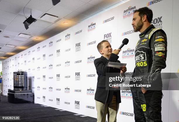 Jimmie Johnson, driver of the Lowe's for Pros Chevrolet, talks to the media during the Daytona 500 Media Day at Daytona International Speedway on...