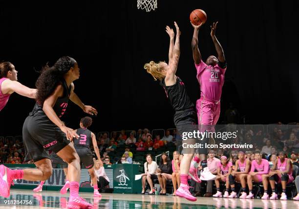 Florida State forward Shakayla Thomas shoots against Miami forward/center Emese Hof during a women's college basketball game between the Florida...