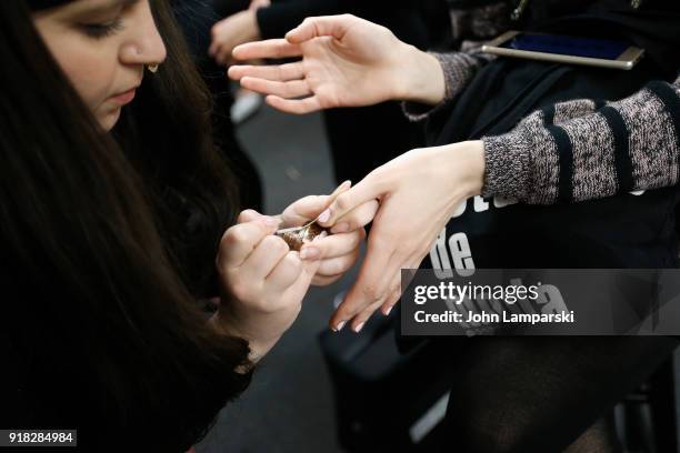 Models, finger nail detail, prepare backstage during the Leanne Marshall show during February 2018 New York Fashion Week: The Shows at Gallery II at...