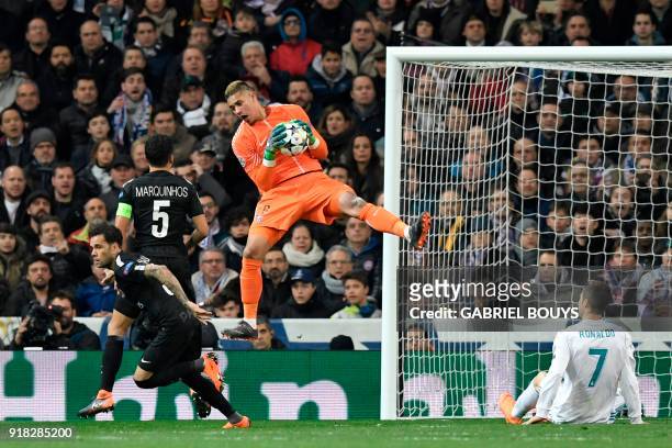 Paris Saint-Germain's French goalkeeper Alphonse Areola grabs the ball during the UEFA Champions League round of sixteen first leg football match...