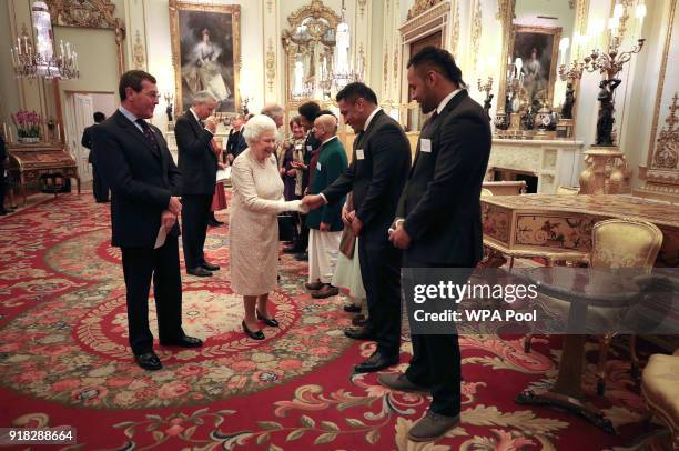 Queen Elizabeth II meets rugby players Mako and Billy Vunipola at a reception to celebrate the Commonwealth Diaspora community, in the lead up to the...