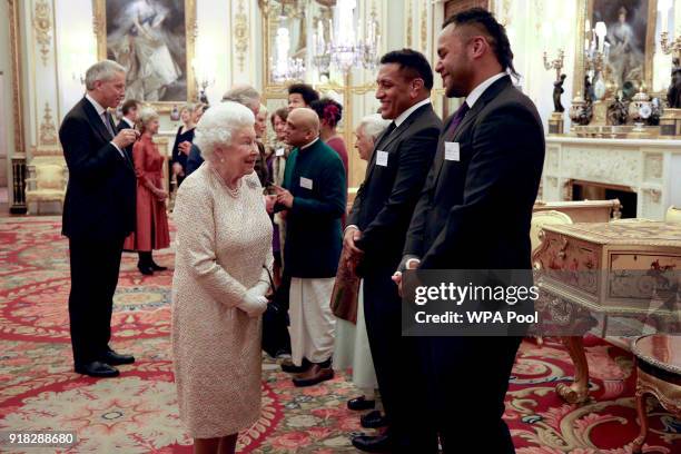 Queen Elizabeth II meets rugby players Mako and Billy Vunipola at a reception to celebrate the Commonwealth Diaspora community, in the lead up to the...