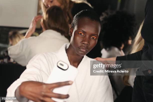 Model takes a selfie backstage at the Maryam Nassir Zadeh fashion show during New York Fashion Week on February 14, 2018 in New York City.