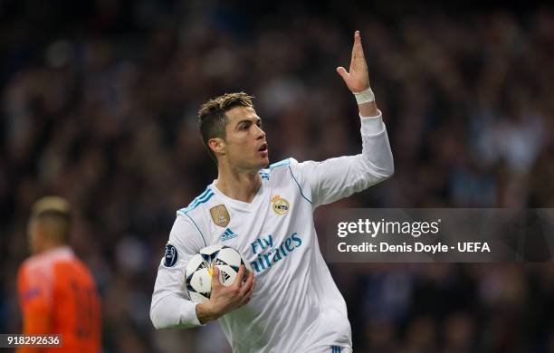 Cristiano Ronaldo of Real Madrid celebrates after scoring his team's opening goal from the penalty spot during the UEFA Champions League Round of 16...