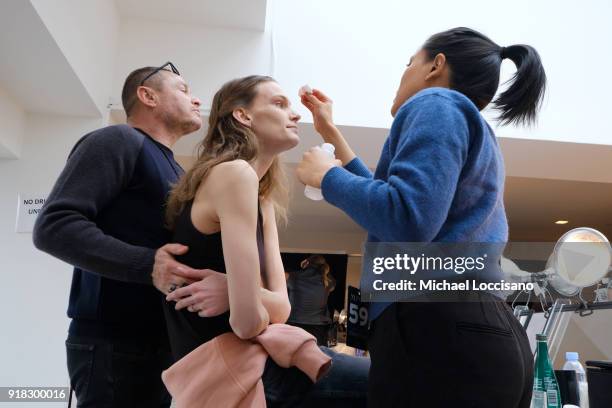 Model prepares backstage for Esteban Cortazar during New York Fashion Week: The Shows at Gallery I at Spring Studios on February 14, 2018 in New York...