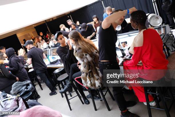 Model prepares backstage for Esteban Cortazar during New York Fashion Week: The Shows at Gallery I at Spring Studios on February 14, 2018 in New York...