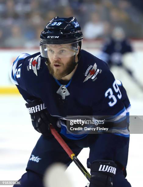 Toby Enstrom of the Winnipeg Jets gets set for a first period face-off against the New York Rangers at the Bell MTS Place on February 11, 2018 in...