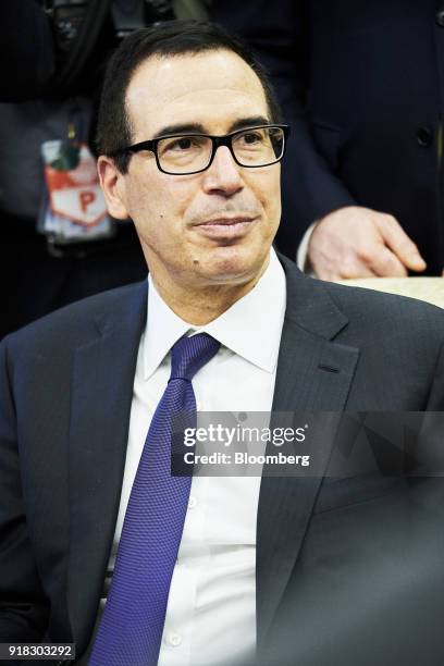 Steven Mnuchin, U.S. Treasury secretary, listens during a working session regarding the Opportunity Zones provided by tax reform in the Oval Office...