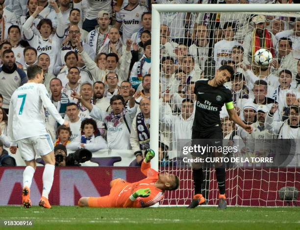 Real Madrid's Portuguese forward Cristiano Ronaldo scores a goal during the UEFA Champions League round of sixteen first leg football match Real...