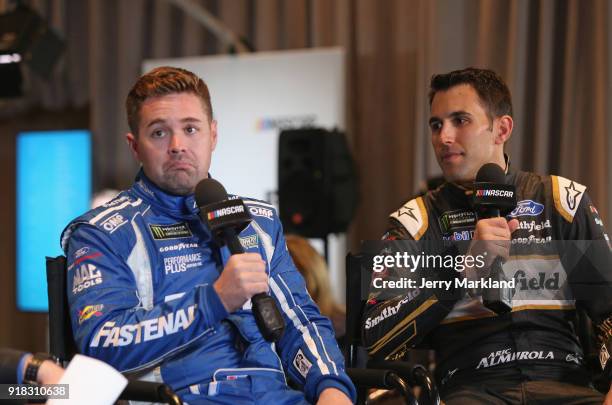 Ricky Stenhouse Jr., driver of the Fastenal Ford, and Aric Almirola, driver of the Smithfield Ford, talk to the media during the Daytona 500 Media...