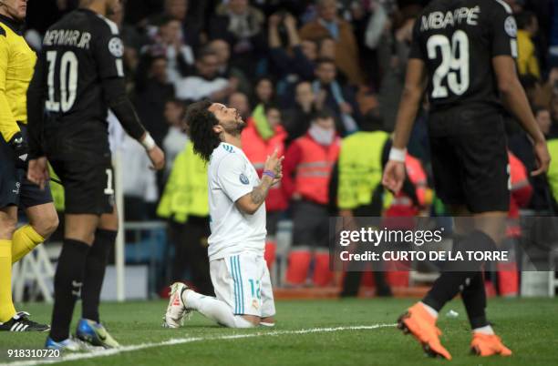 Real Madrid's Brazilian defender Marcelo celebrates a goal during the UEFA Champions League round of sixteen first leg football match Real Madrid CF...