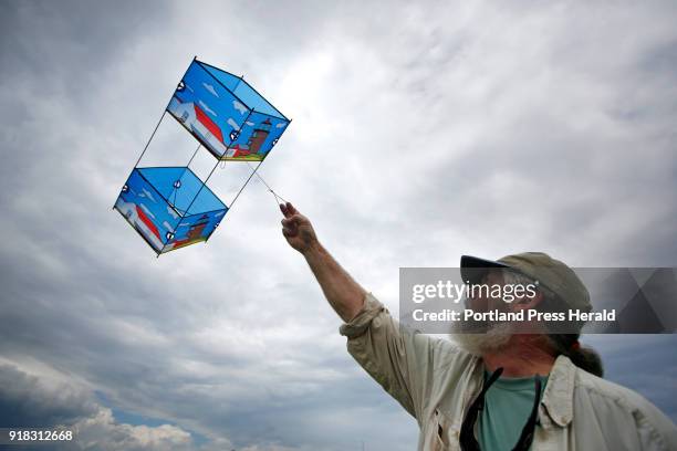 Tony Otis flies a box kite inspired by Monhegan Island Light that will be part of an exhbit at Mayo Street arts in the summer.