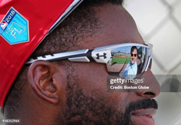 Tony LaRussa, executive vice president and special assistant to Dave Dombrowski is reflected in the sunglasses of Red Sox centerfielder Jackie...