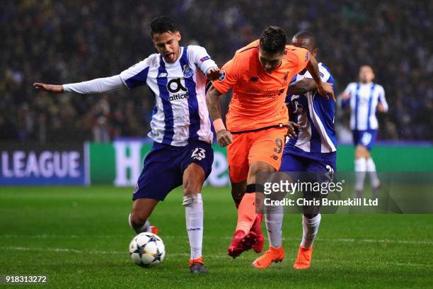 Roberto Firmino of Liverpool battles with Diego Reyes of FC Porto during the UEFA Champions League Round of 16 First Leg match between FC Porto and...