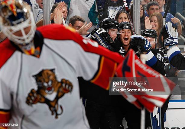 Ryan Malone of the Tampa Bay Lightning celebrates his game-winning goal with teammates Victor Hedman and Steven Stamkos in the third period against...