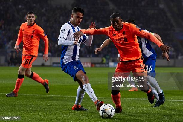 Georginio Wijnaldum of Liverpool FC is challenged by Diego Reyes of FC Porto during the UEFA Champions League Round of 16 First Leg match between FC...