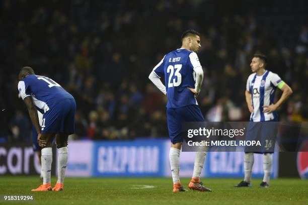 Porto's Malian striker Moussa Marega , Porto's Mexican defender Diego Reyes and Porto's Mexican midfielder Hector Herrera react to their defeat on...