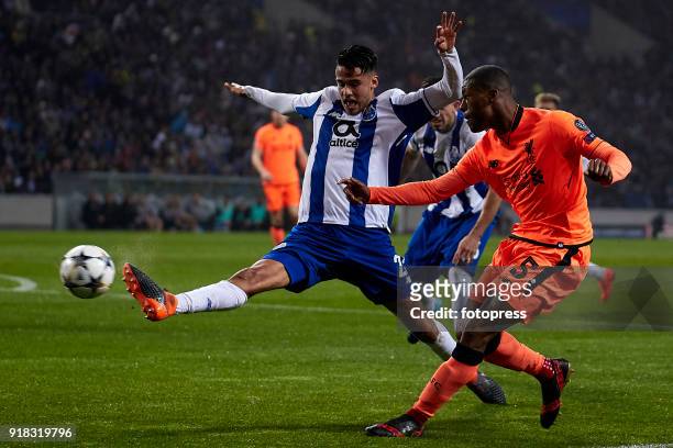 Diego Reyes of FC Porto competes for the ball with Georginio Wijnaldum of Liverpool FC during the UEFA Champions League Round of 16 First Leg match...