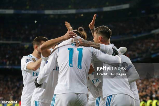 Cristiano Ronaldo of Real Madrid celebrates after scoring his team`s second goal with team mates during the UEFA Champions League Round of 16 First...