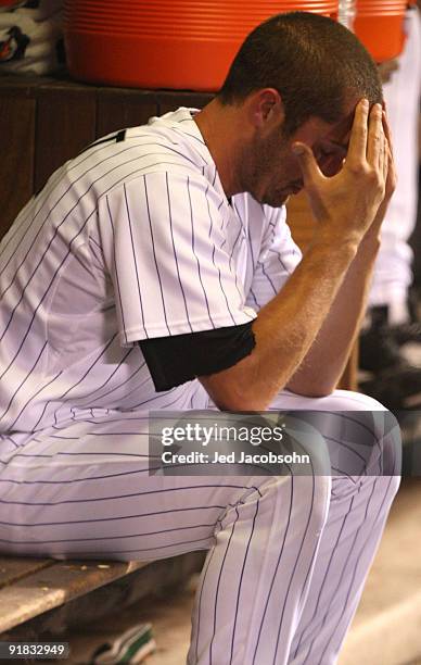 Huston Street of the Colorado Rockies sits dejected in the dugout against the Philadelphia Phillies in Game Four of the NLDS during the 2009 MLB...