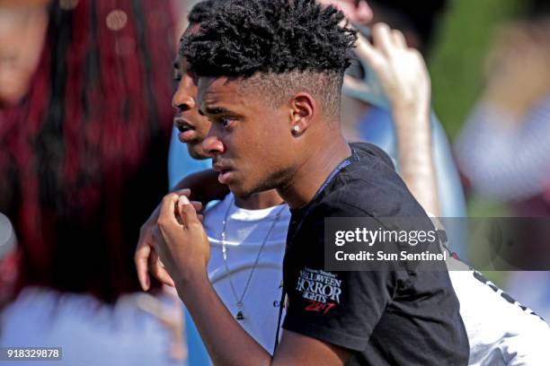 Students are released from a lockdown outside of Stoneman Douglas High School in Parkland, Fla. After reports of an active shooter on Wednesday, Feb....