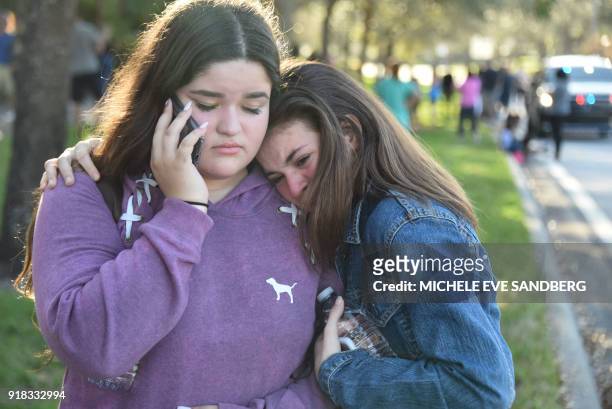 Students react following a shooting at Marjory Stoneman Douglas High School in Parkland, Florida, a city about 50 miles north of Miami on February...