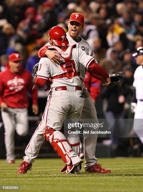 Brad Lidge of the Philadelphia Phillies celebrates with catcher Carlos Ruiz after defeating the Colorado Rockies in Game Four of the NLDS during the...