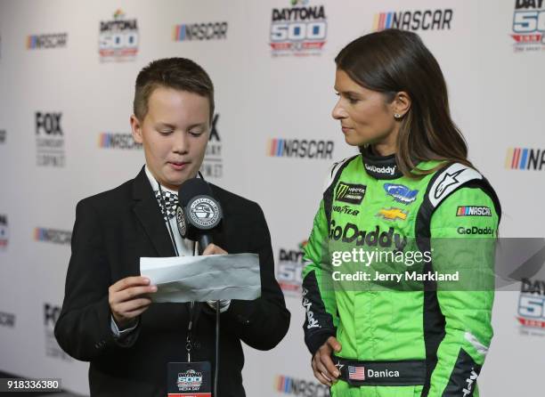 Danica Patrick, driver of the GoDaddy Chevrolet, talks to the media during the Daytona 500 Media Day at Daytona International Speedway on February...