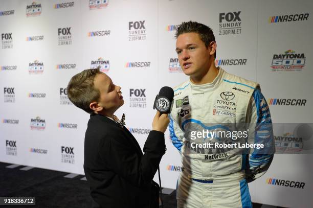 Gray Gaulding, driver of the Toyota, talks to the media during the Daytona 500 Media Day at Daytona International Speedway on February 14, 2018 in...