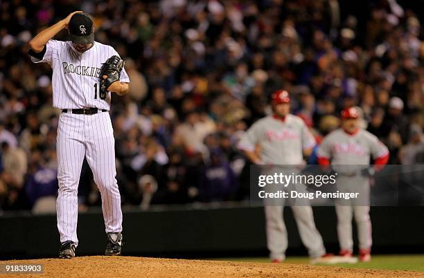 Pitcher Huston Street of the Colorado Rockies reacts as he returns to the mound after giving up the game winning RBI single to Jayson Werth of the...