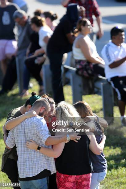 Waiting for word from students at Coral Springs Drive and the Sawgrass Expressway just south of the campus of Stoneman Douglas High School in...