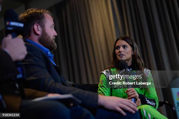 Danica Patrick, driver of the GoDaddy Chevrolet, talks to the media during the Daytona 500 Media Day at Daytona International Speedway on February...