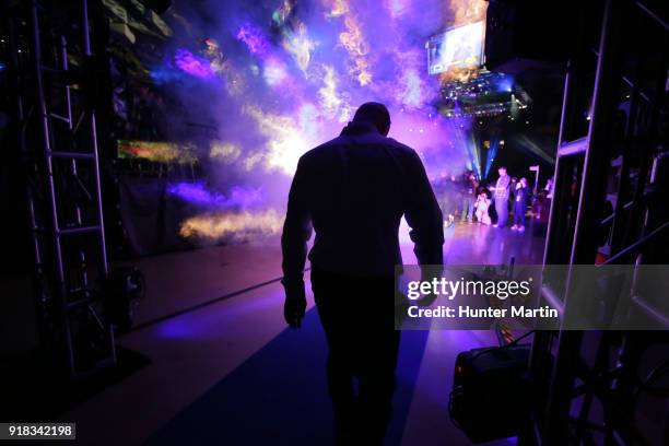 Head coach Cael Sanderson of the Penn State Nittany Lions walks onto the arena floor during introductions before a match against the Iowa Hawkeyes on...