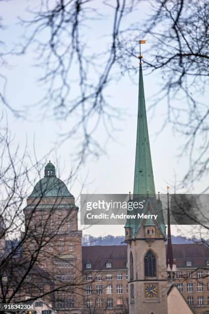 zurich skyline with predigerkirche church tower, clock, steeple, spire with pale blue sky - bokeh museum stock pictures, royalty-free photos & images