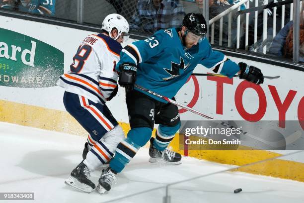 Barclay Goodrow of the San Jose Sharks and Ryan Strome of the Edmonton Oilers battle for the puck at SAP Center on February 10, 2018 in San Jose,...