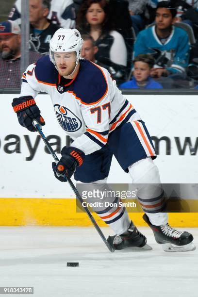 Oscar Klefbom of the Edmonton Oilers handles the puck during a NHL game against the San Jose Sharks at SAP Center on February 10, 2018 in San Jose,...