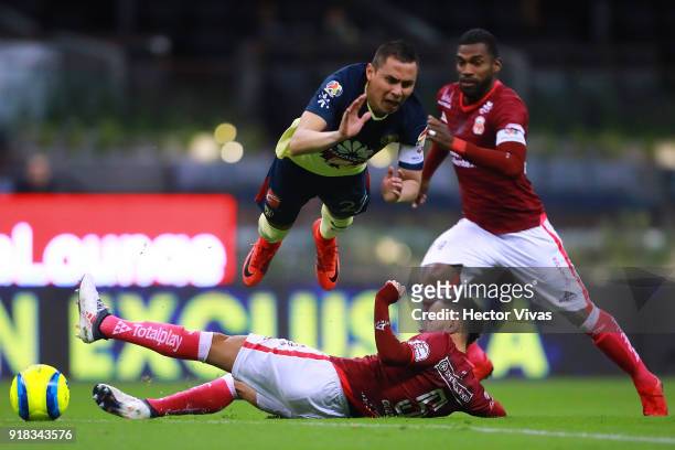 Paul Aguilar of America struggles for the ball with Carlos Guzman of Morelia during the 7th round match between America and Monarcas as part of the...