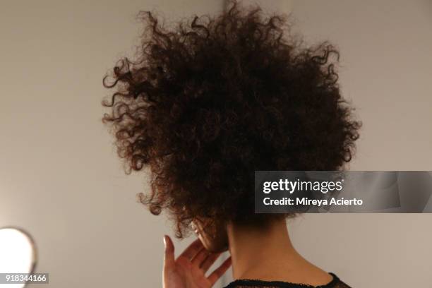 Model, hair detail, prepares backstage for Irina Vitjaz during New York Fashion Week: The Shows at Gallery I at Spring Studios on February 14, 2018...