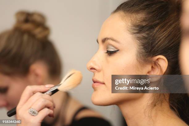 Model prepares backstage for Irina Vitjaz during New York Fashion Week: The Shows at Gallery I at Spring Studios on February 14, 2018 in New York...
