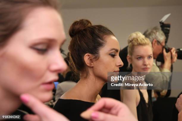 Models prepare backstage for Irina Vitjaz during New York Fashion Week: The Shows at Gallery I at Spring Studios on February 14, 2018 in New York...