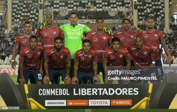 Bolivia's team Jorge Wilstermann poses for pictures before the start of the Libertadores Cup football match against Brazil's Vasco da Gama at the Sao...