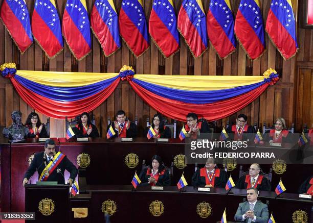 Venezuelan President Nicolas Maduro speaks during a ceremony in the opening of the judicial year at the Supreme Court in Caracas, on February 14,...